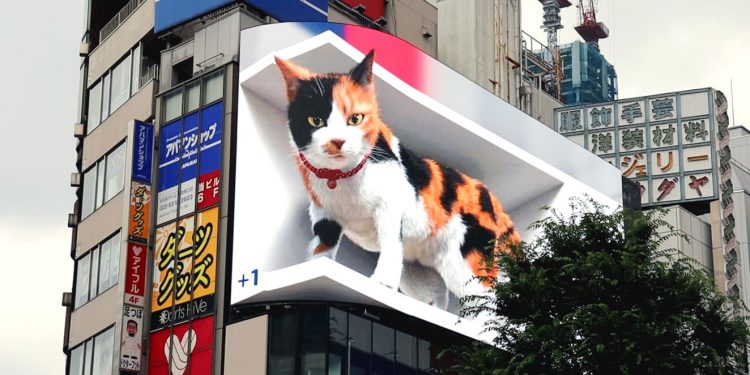 Watch A Giant 3D Cat Atop A Tokyo Train Station Catches Commuters By Surprise