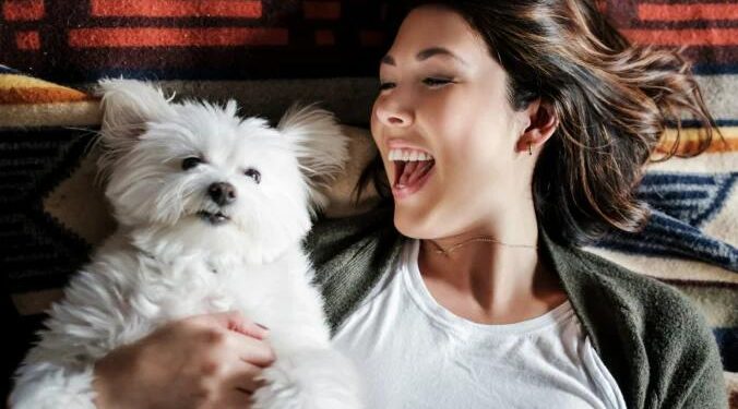 Letting your pet sleep in your bed may be just what the doctor ordered